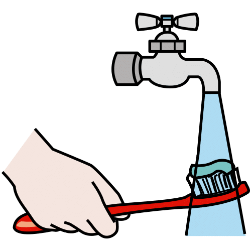 Imagen limpiando un cepillo de dientes bajo el grifo